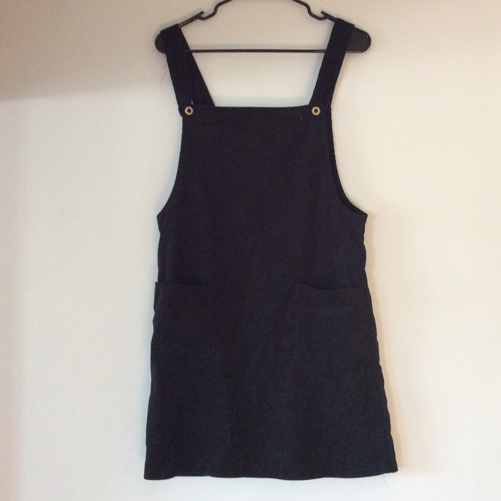 Woman’s black overall dress